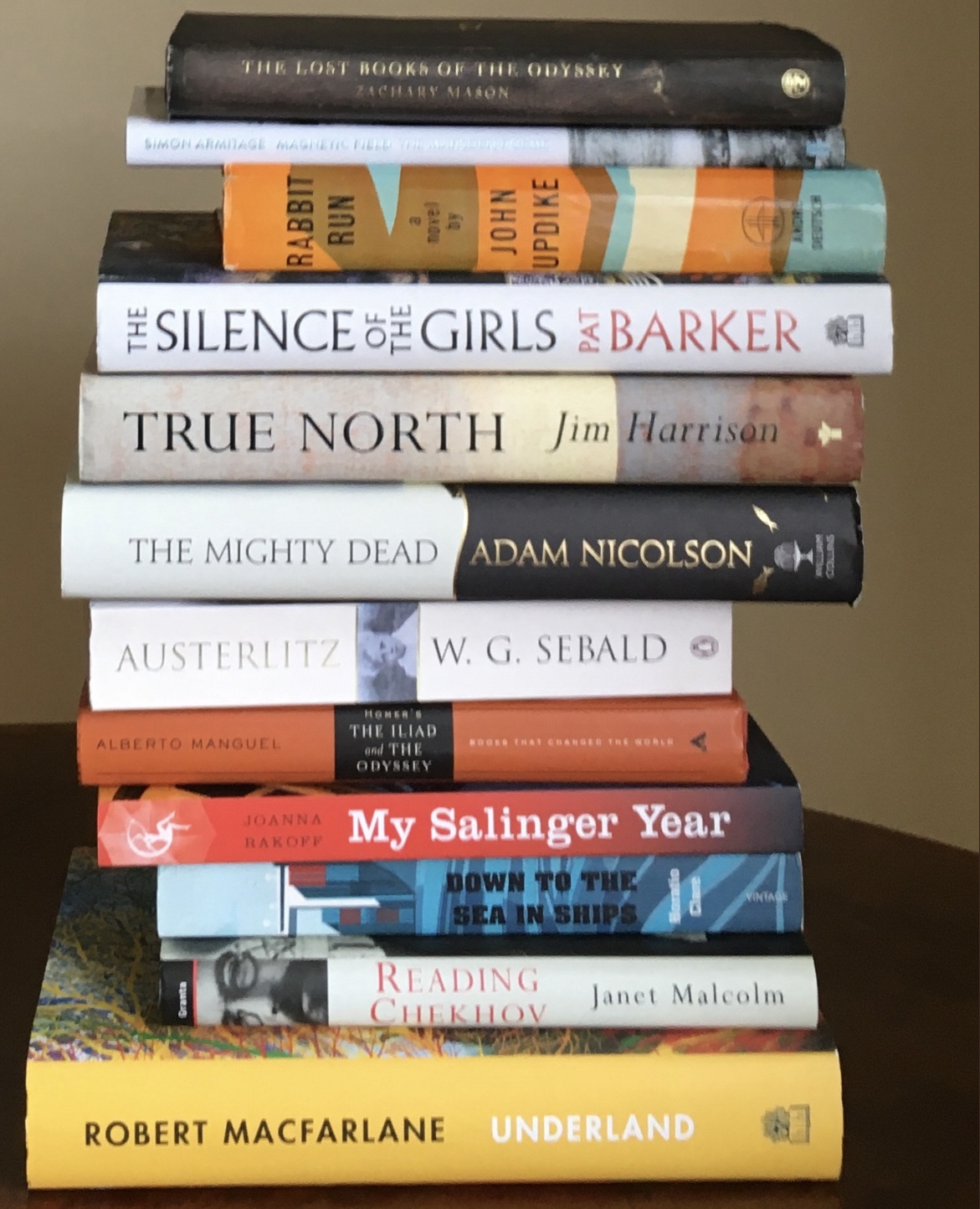 A pile of books stacked vertically